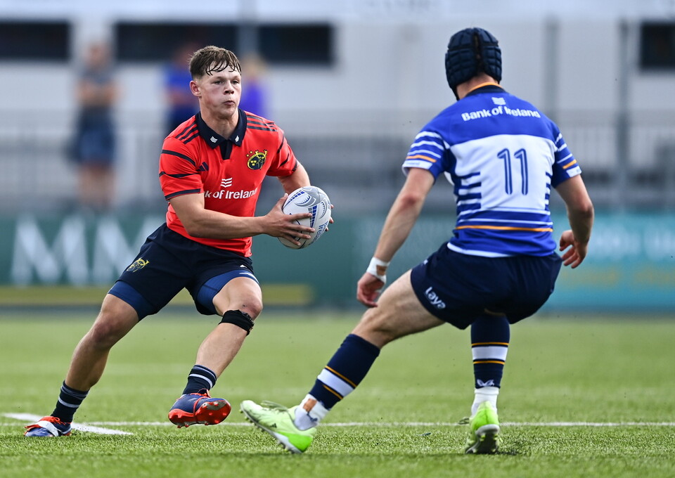 Munster's Josh Devlin comes up against Leinster winger Rocco Quigley