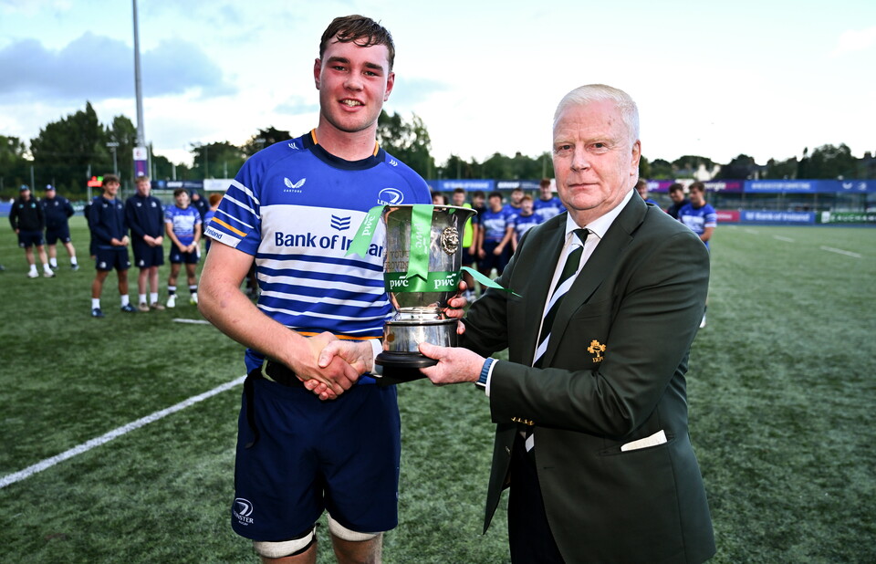 Leinster U-18 Clubs captain Aidan Tamming with the IRFU's Joe McDermott