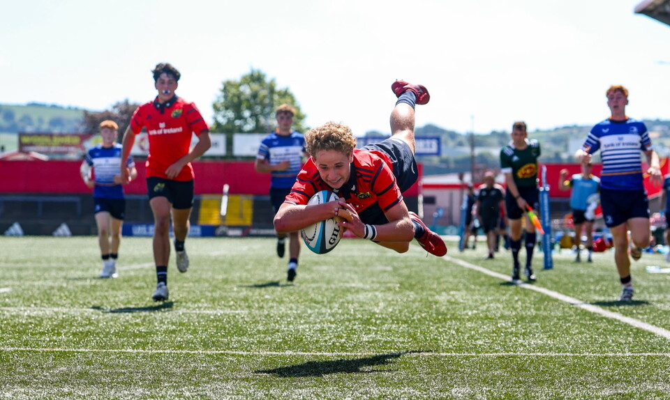 Adam Bennett dives over to score for the Munster U-18 Schools side