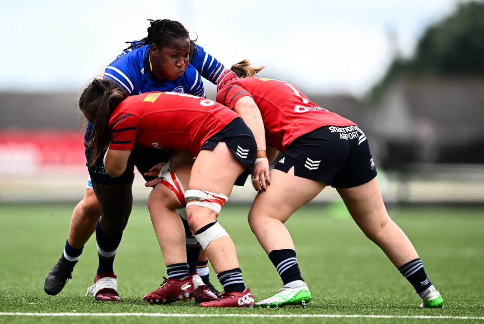 Linda Djougang is tackled by Maeve Óg O'Leary and Siobhán McCarthy