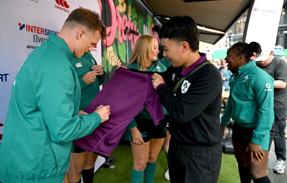 Josh van der Flier signs a jersey for a fan