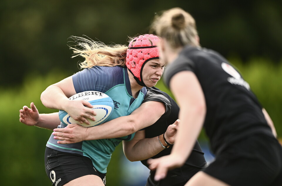Dorothy Wall drives forward with ball in hand