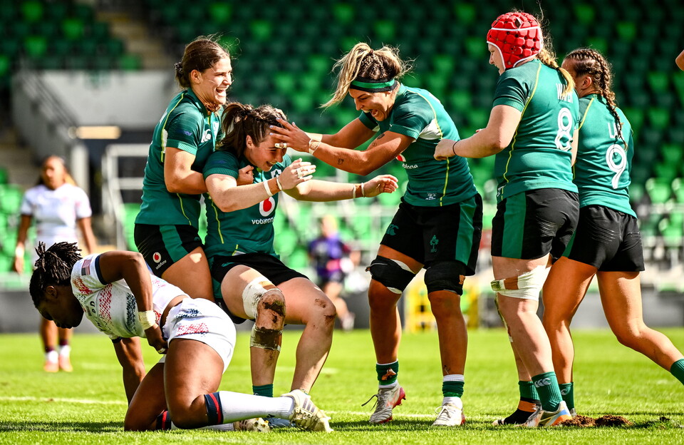 Try scorer Eve Higgins is congratulated by her team-mates