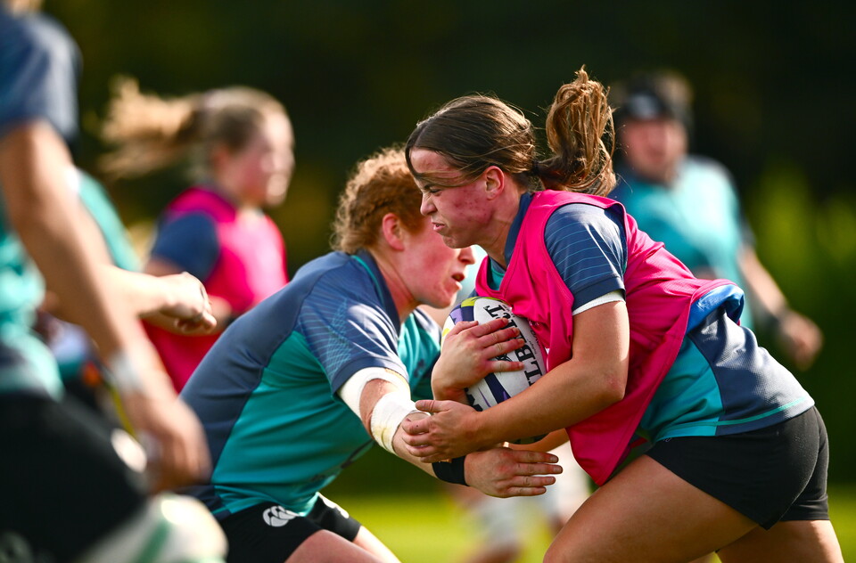 Robyn O'Connor drives into Niamh O'Dowd's tackle