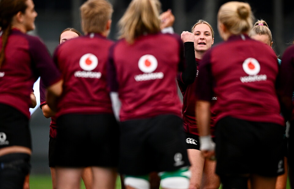 Alana McInerney in a huddle at training