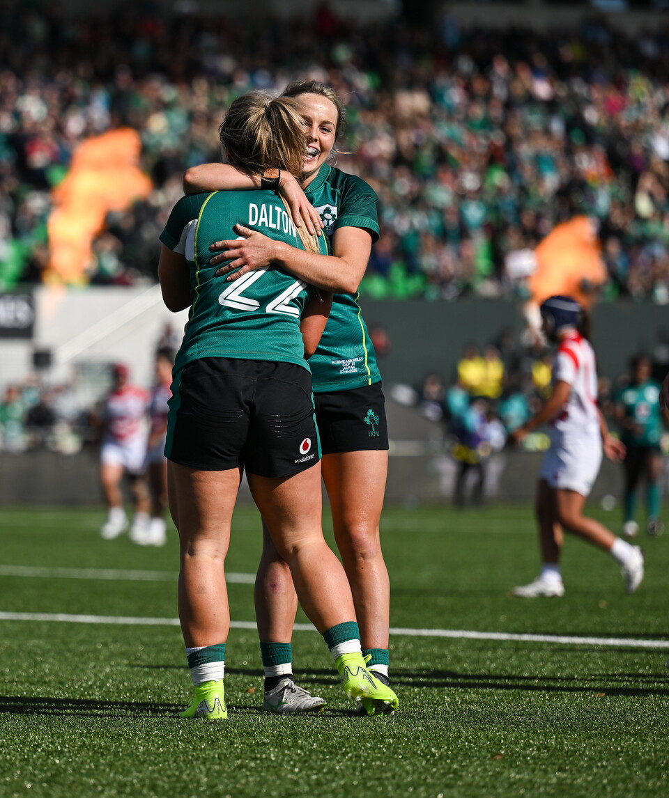 Aoibheann Reilly celebrates with try scorer Aoife Dalton