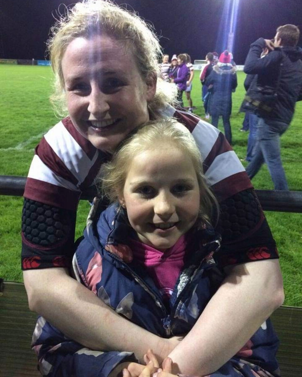 A young Roisin watching her mom play