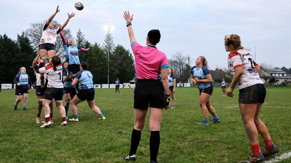 referee at a lineout in a club game