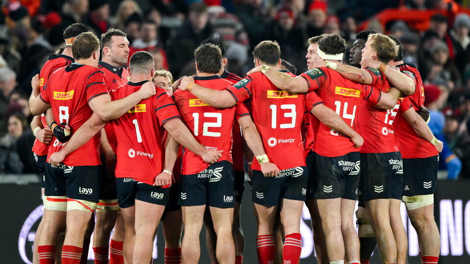 The Munster players huddle together