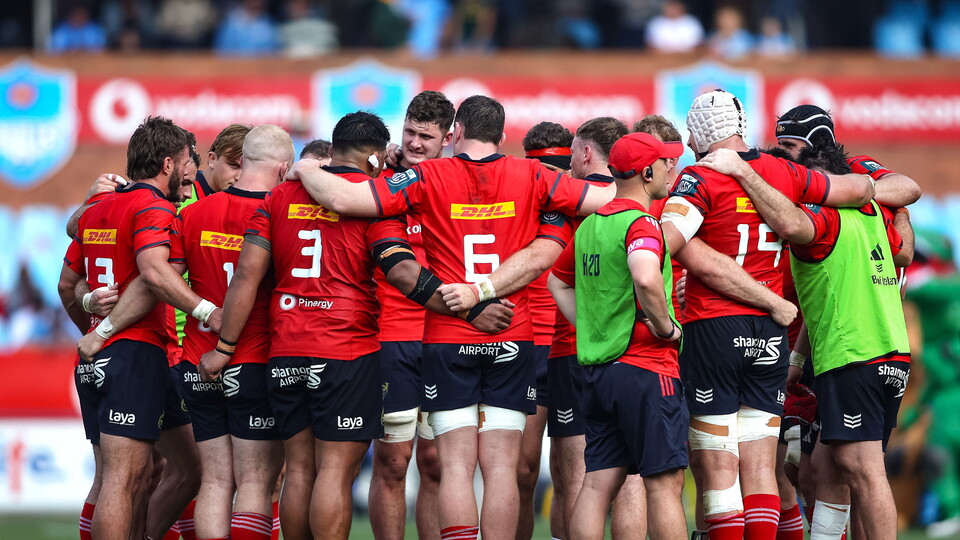 The Munster squad huddle together