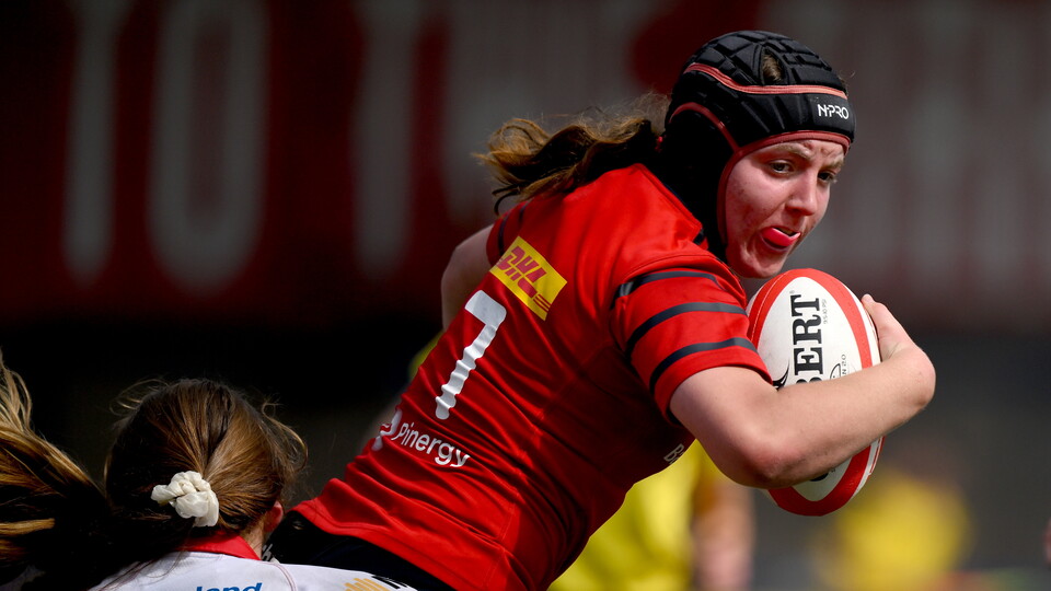 Munster's Sally Kelly takes on the Ulster defence