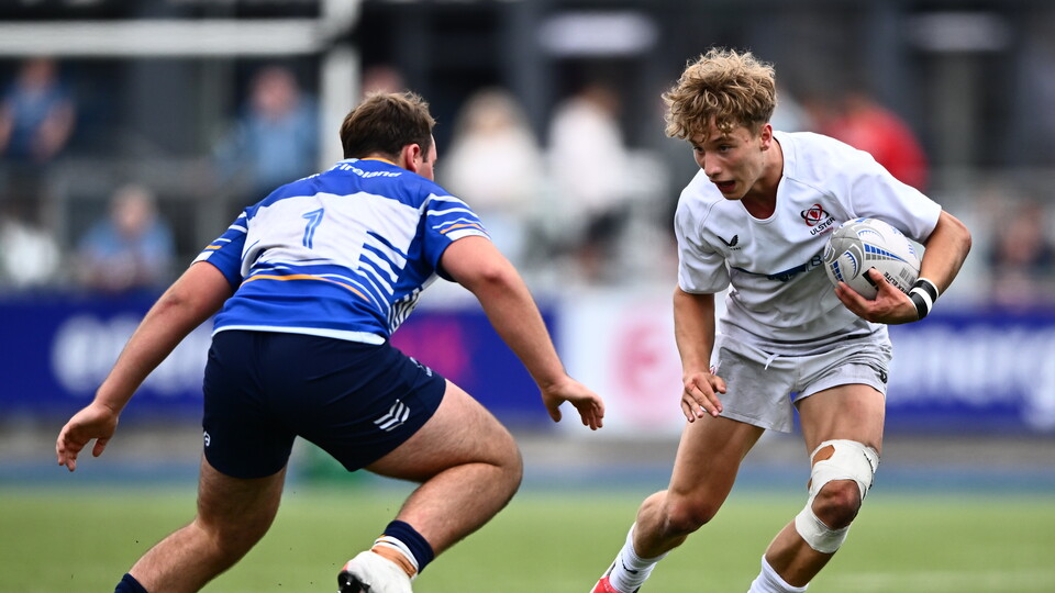 Ulster Schools winger Zach Thompson takes on Leinster's Hugo Ivers McCormack