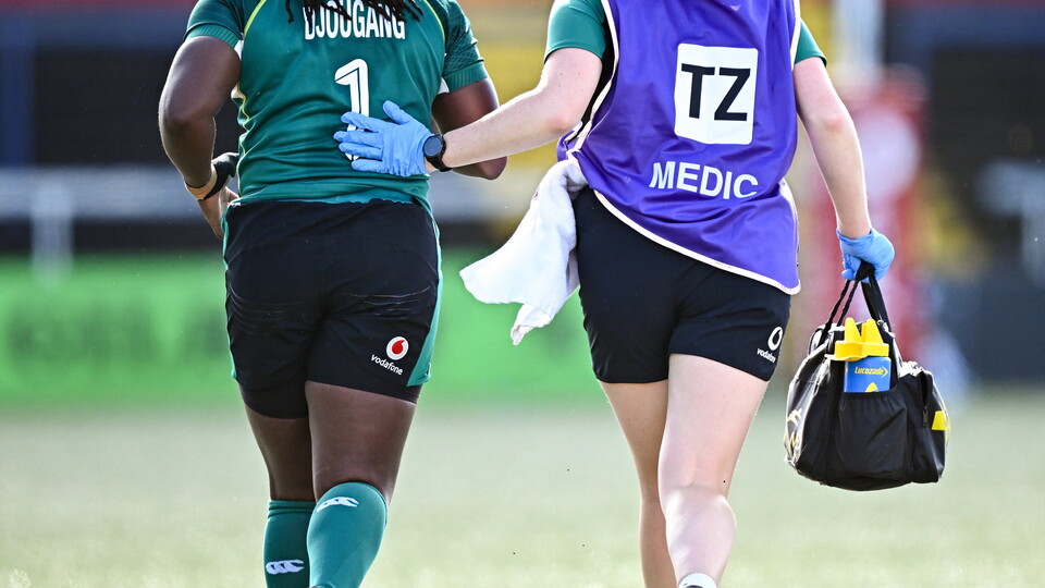 Physio and player running off field