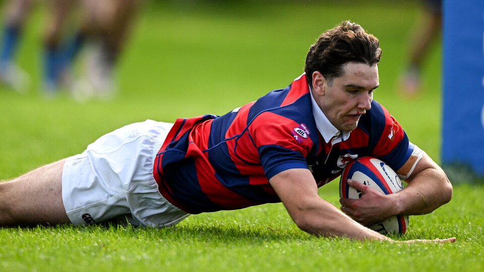 Matthew Brennan of Clontarf scores a try