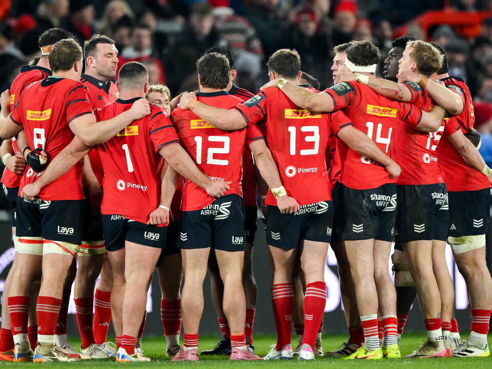 The Munster players huddle together