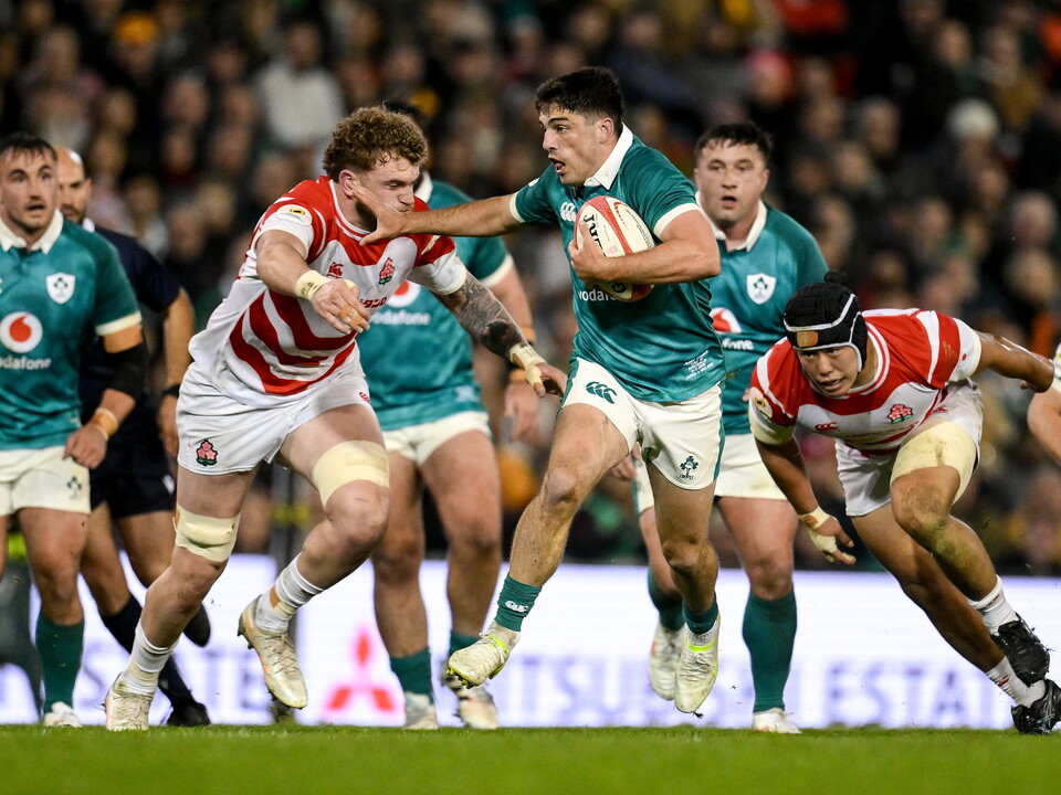 Jimmy O'Brien tries to break past Japan's Warner Dearns